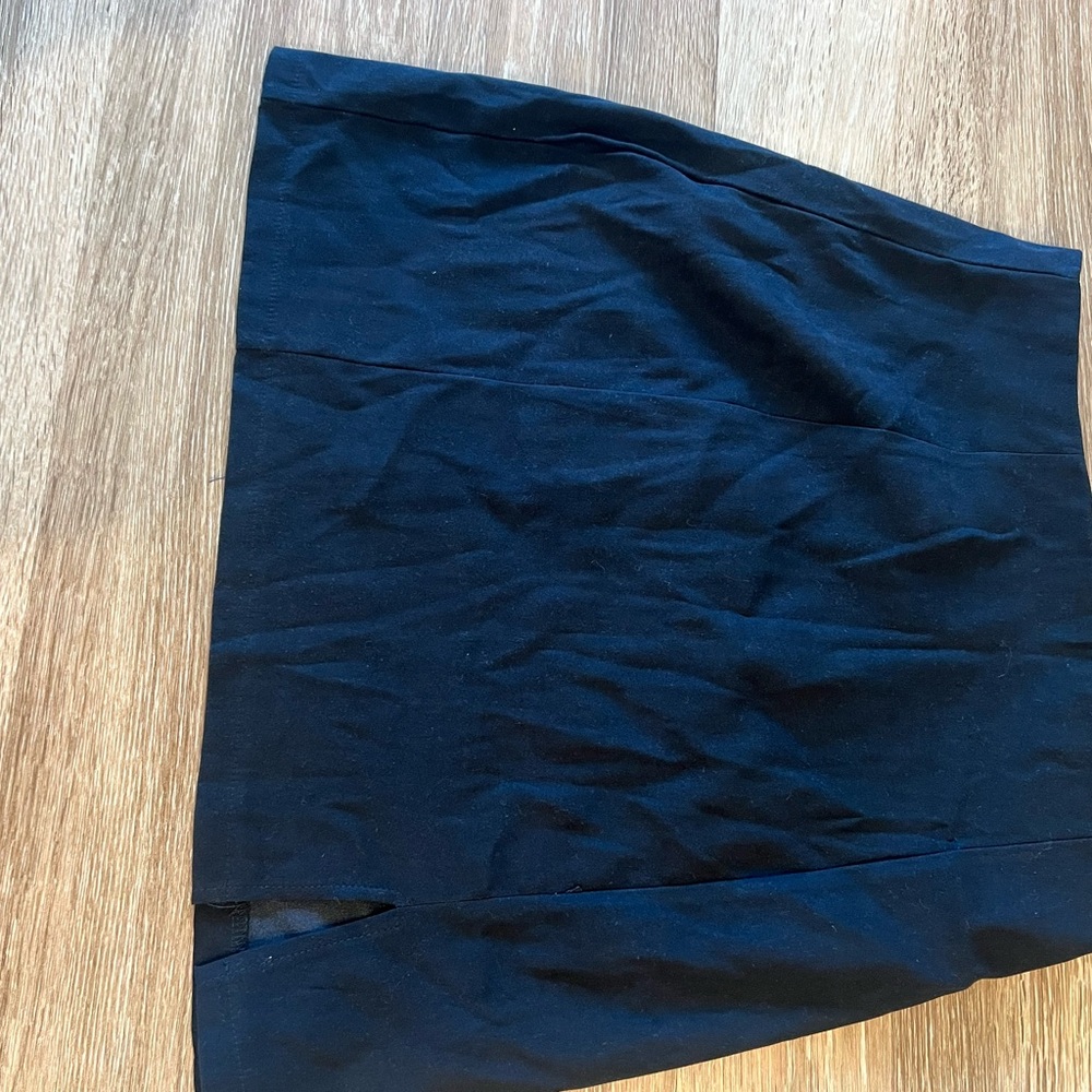 Short black pencil skirt with small slit